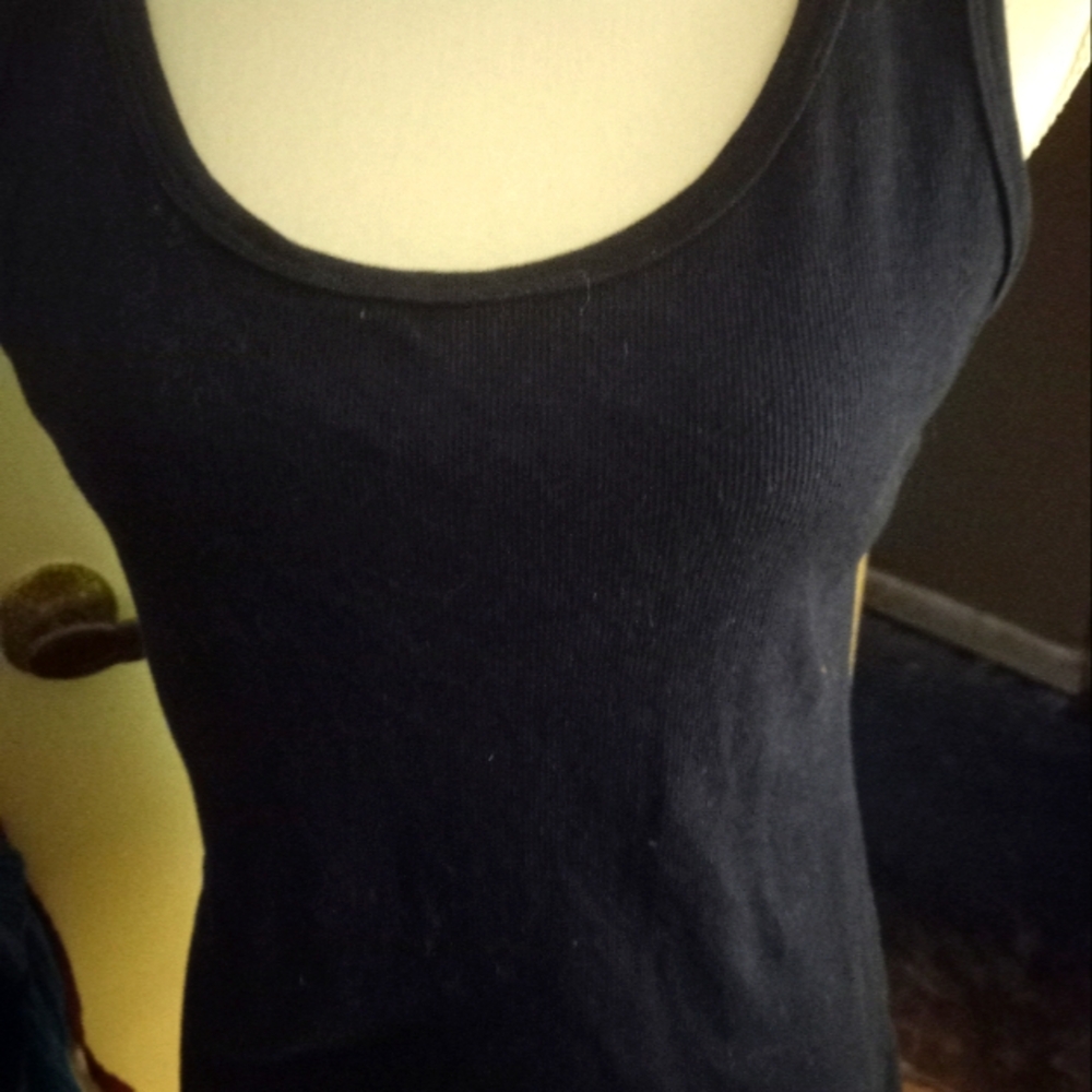 Used,not new navy camisole,tank top ribbed knit. size is medium.